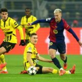 Soccer Football - Champions League - Borussia Dortmund v FC Barcelona - Signal Iduna Park, Dortmund, Germany - December 11, 2024 FC Barcelona's Dani Olmo in action with Borussia Dortmund's Giovanni Reyna and Nico Schlotterbeck REUTERS/Leon Kuegeler Photo: LEON KUEGELER/REUTERS