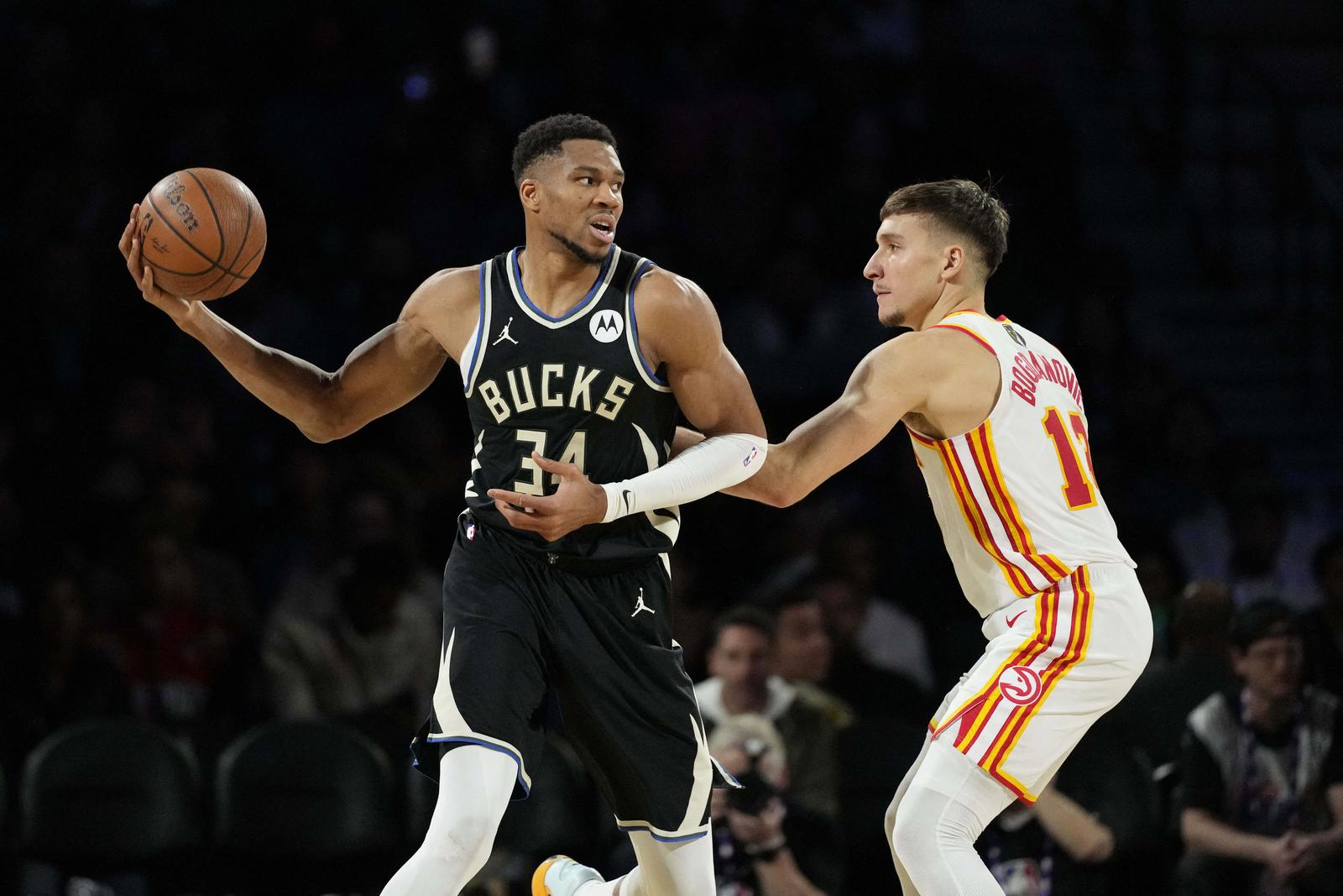 Dec 14, 2024; Las Vegas, Nevada, USA; Milwaukee Bucks forward Giannis Antetokounmpo (34) controls the ball against Atlanta Hawks guard Bogdan Bogdanovic (13) during the second quarter in a semifinal of the 2024 Emirates NBA Cup at T-Mobile Arena. Mandatory Credit: Kyle Terada-Imagn Images Photo: Kyle Terada/REUTERS