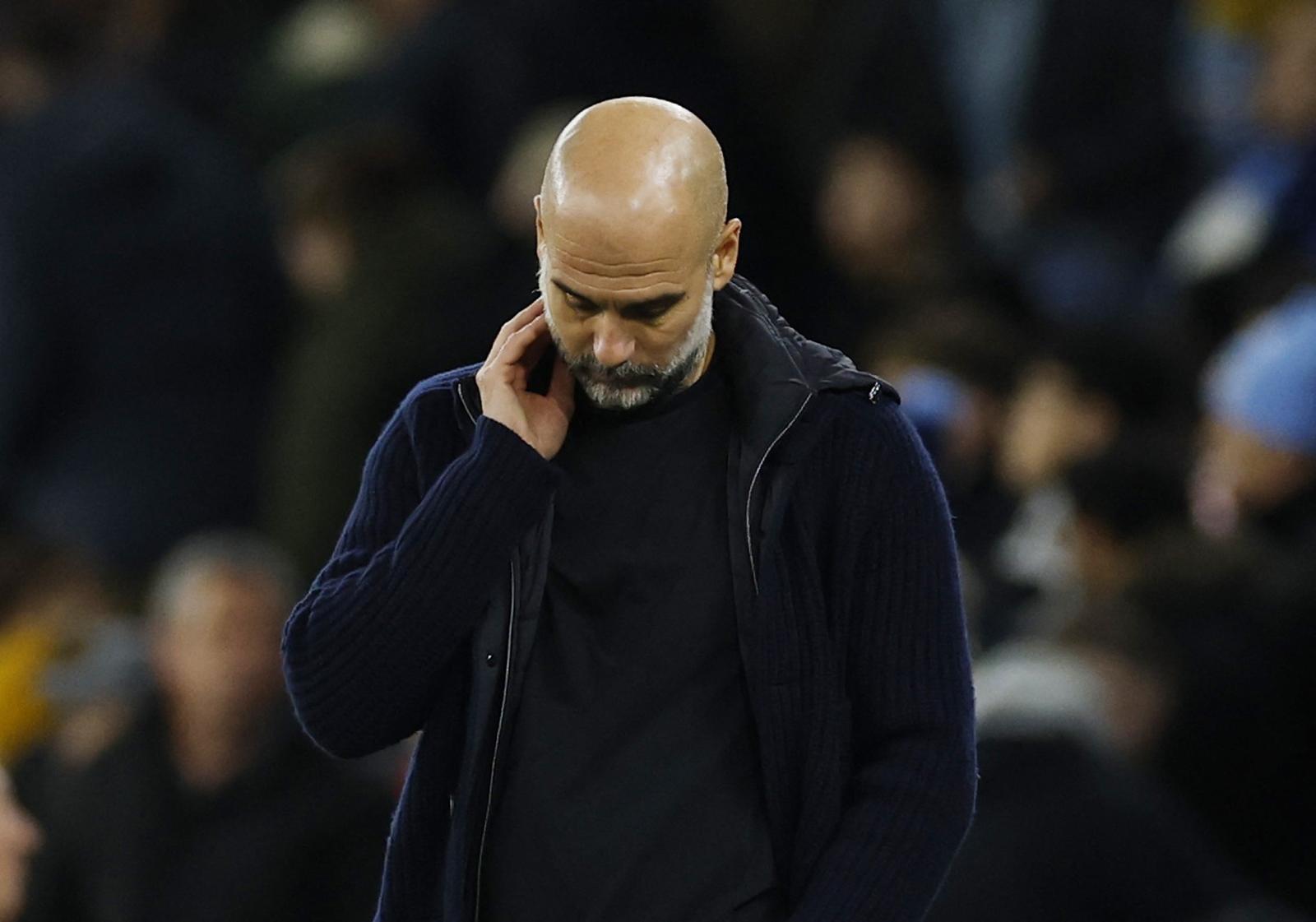 Soccer Football - Premier League - Manchester City v Manchester United - Etihad Stadium, Manchester, Britain - December 15, 2024 Manchester City manager Pep Guardiola looks dejected after the match Action Images via Reuters/Jason Cairnduff EDITORIAL USE ONLY. NO USE WITH UNAUTHORIZED AUDIO, VIDEO, DATA, FIXTURE LISTS, CLUB/LEAGUE LOGOS OR 'LIVE' SERVICES. ONLINE IN-MATCH USE LIMITED TO 120 IMAGES, NO VIDEO EMULATION. NO USE IN BETTING, GAMES OR SINGLE CLUB/LEAGUE/PLAYER PUBLICATIONS. PLEASE CONTACT YOUR ACCOUNT REPRESENTATIVE FOR FURTHER DETAILS.. Photo: Jason Cairnduff/REUTERS