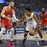 Dec 16, 2024; Inglewood, California, USA;   Utah Jazz guard Collin Sexton (2) is defended by Los Angeles Clippers center Ivica Zubac (40) in the first half at Intuit Dome. Mandatory Credit: Jayne Kamin-Oncea-Imagn Images Photo: Jayne Kamin-Oncea/REUTERS