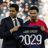 Soccer Football - Ligue 1 - Paris St Germain v Le Havre - Parc des Princes, Paris, France - April 27, 2024 Paris Saint-Germain's Warren Zaire-Emery poses on the pitch before the match after signing a new contract with president Nasser Al-Khelaifi REUTERS/Gonzalo Fuentes Photo: GONZALO FUENTES/REUTERS