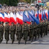 August 15, 2024, Warsaw, Poland: Servicemen of the Polish Army march with Polish and NATO flags at Wislostrada in the centre of Warsaw, the capital Poland as crowds gather to watch the military parade on Polish Army Day. Poland's armed forces, along with allied troops stationed in the country, participated in a parade in front of the public, the media, and assembled dignitaries. Before the parade, Poland's Deputy Prime Minister and Minister of National Defence, Wladyslaw Kosiniak-Kamysz, Poland's Prime Minister, Donald Tusk, and Poland's President, Andrzej Duda addressed the public and the assembled media. The parade featured soldiers, mechanized divisions, tanks, various armoured vehicles, and a fly-over by members of Poland's Air Force.,Image: 899268424, License: Rights-managed, Restrictions: , Model Release: no, Credit line: Marek Antoni Iwanczuk / Zuma Press / Profimedia