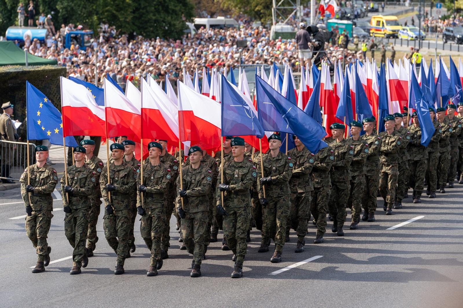 August 15, 2024, Warsaw, Poland: Servicemen of the Polish Army march with Polish and NATO flags at Wislostrada in the centre of Warsaw, the capital Poland as crowds gather to watch the military parade on Polish Army Day. Poland's armed forces, along with allied troops stationed in the country, participated in a parade in front of the public, the media, and assembled dignitaries. Before the parade, Poland's Deputy Prime Minister and Minister of National Defence, Wladyslaw Kosiniak-Kamysz, Poland's Prime Minister, Donald Tusk, and Poland's President, Andrzej Duda addressed the public and the assembled media. The parade featured soldiers, mechanized divisions, tanks, various armoured vehicles, and a fly-over by members of Poland's Air Force.,Image: 899268424, License: Rights-managed, Restrictions: , Model Release: no, Credit line: Marek Antoni Iwanczuk / Zuma Press / Profimedia