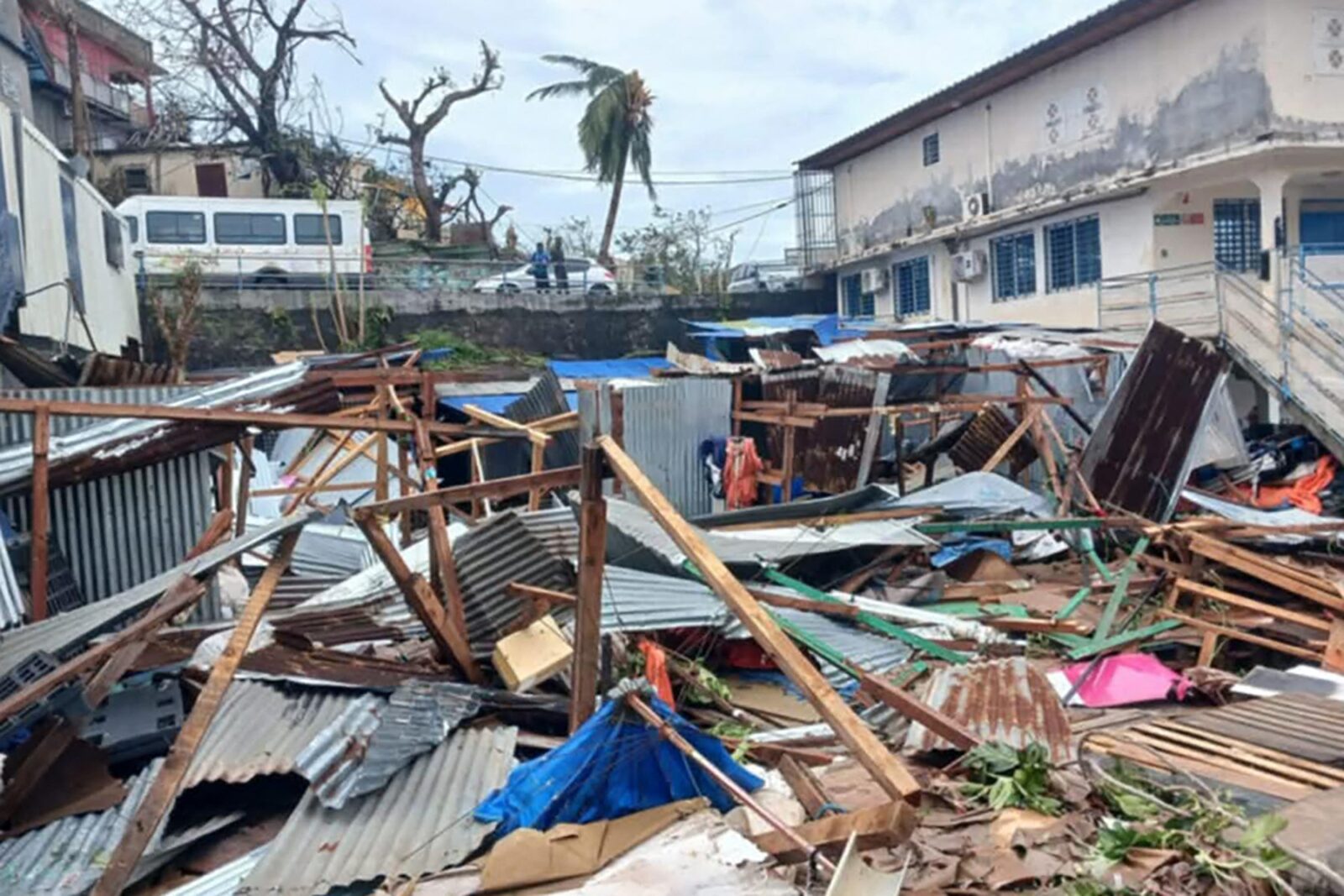 This photograph shows a pile of debris of metal sheets and wood after the cyclone Chido hit France's Indian Ocean territory of Mayotte, on December 14, 2024 in the capital Mamoudzou. At least 14 people were killed in Mayotte when a fierce cyclone battered the French Indian Ocean territory, authorities said on December 15, 2024, with officials warning it will take days to know the full toll.,Image: 946966209, License: Rights-managed, Restrictions: , Model Release: no, Credit line: Daniel MOUHAMADI / AFP / Profimedia