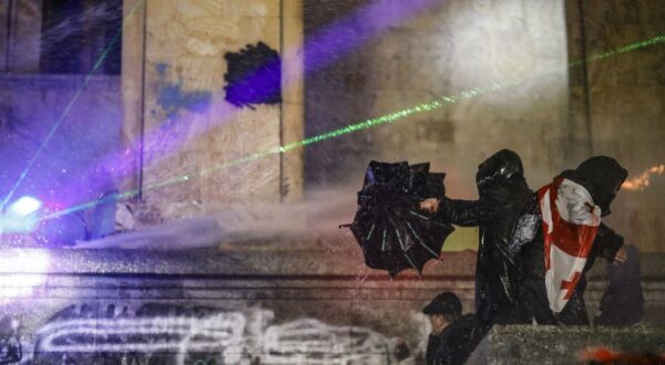 epaselect epa11752433 Police use water cannons to disperse Georgian opposition supporters protesting in front of the Parliament building in Tbilisi, Georgia, 01 December 2024. Thousands of pro-EU activists demonstrated in the Georgian capital of Tbilisi to protest against the country's ruling party decision to suspend accession talks with the European Union (EU) until the end of 2028.  EPA/DAVID MDZINARISHVILI