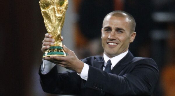 Italian footballer Fabio Cannavaro, captain of the 2006 World Cup winning team presents the world cup trophy prior to the 2010 FIFA football World Cup final between the Netherlands and Spain on July 11, 2010 at Soccer City stadium in Soweto, suburban Johannesburg. NO PUSH TO MOBILE / MOBILE USE SOLELY WITHIN EDITORIAL ARTICLE -,Image: 76785656, License: Rights-managed, Restrictions: NO PUSH TO MOBILE / MOBILE USE SOLELY WITHIN EDITORIAL ARTICLE, Model Release: no, Credit line: THOMAS COEX / AFP / Profimedia