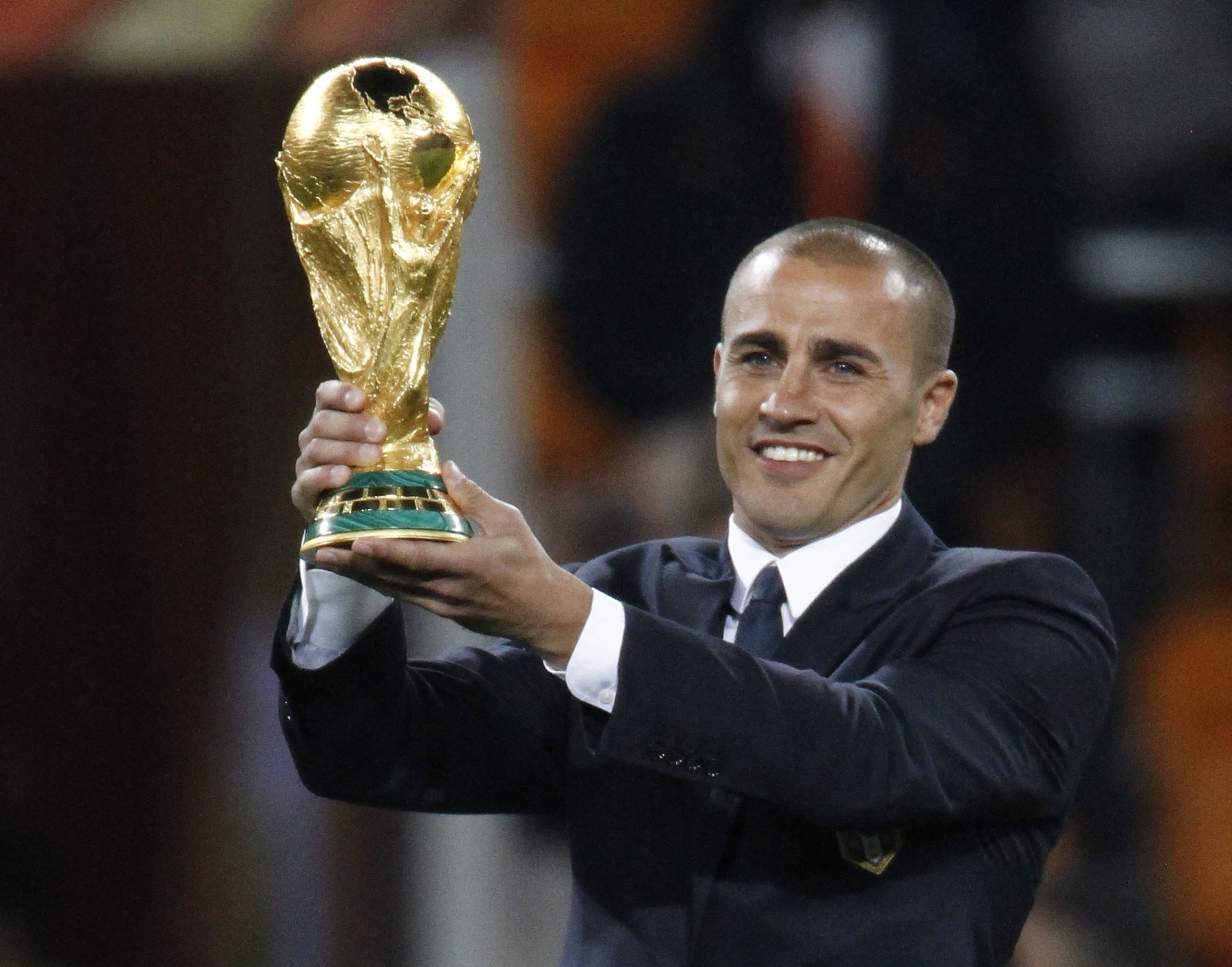 Italian footballer Fabio Cannavaro, captain of the 2006 World Cup winning team presents the world cup trophy prior to the 2010 FIFA football World Cup final between the Netherlands and Spain on July 11, 2010 at Soccer City stadium in Soweto, suburban Johannesburg. NO PUSH TO MOBILE / MOBILE USE SOLELY WITHIN EDITORIAL ARTICLE -,Image: 76785656, License: Rights-managed, Restrictions: NO PUSH TO MOBILE / MOBILE USE SOLELY WITHIN EDITORIAL ARTICLE, Model Release: no, Credit line: THOMAS COEX / AFP / Profimedia