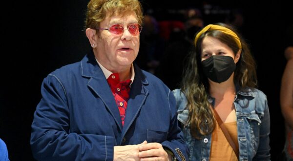 CHICAGO, ILLINOIS - AUGUST 03: Elton John, with lyricist Shaina Taub, after the evening performance of 