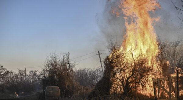 Trees burn next to a Ukrainian military vehicle, after white phosphorus munitions exploded in the air, at the village of Chasiv Yar near Bakhmut, on March 14, 2023, amid the Russian invasion of Ukraine.,Image: 762771122, License: Rights-managed, Restrictions: , Model Release: no, Credit line: Aris Messinis / AFP / Profimedia