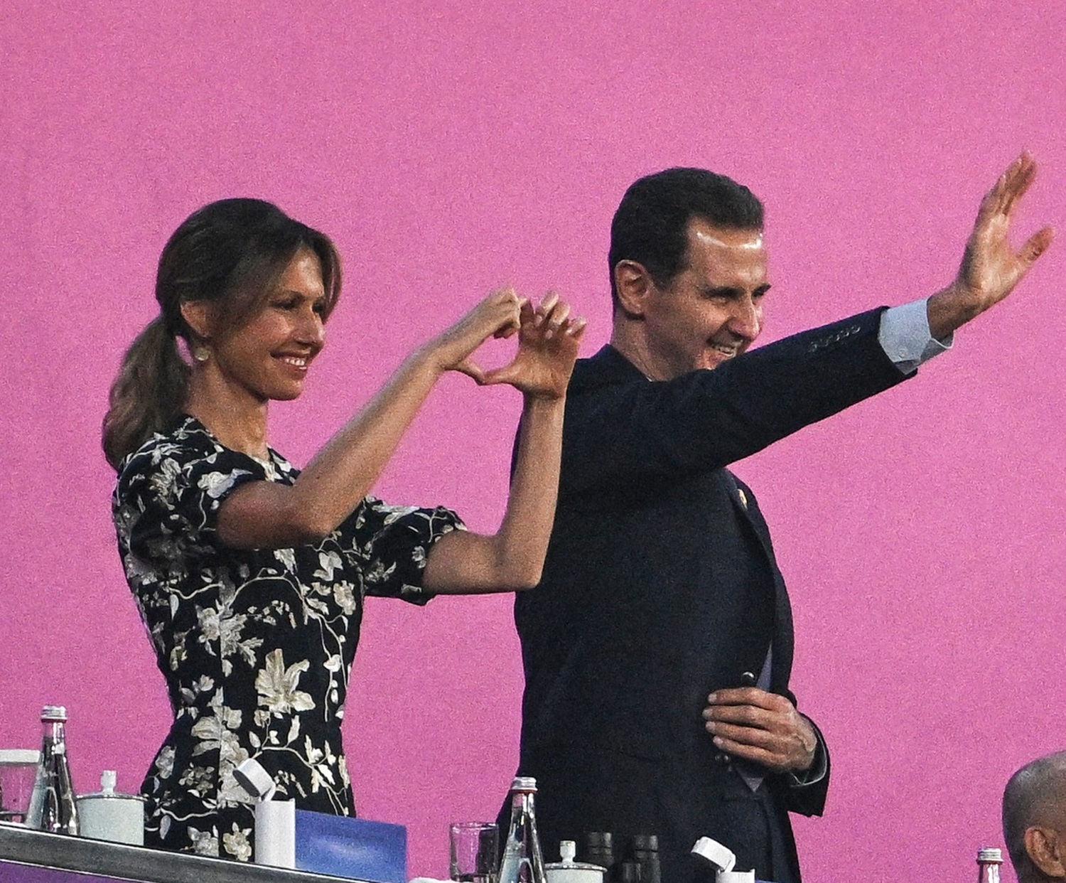 Syria's President Bashar al-Assad (C) and his wife Asma al-Assad (L) attend the opening ceremony of the 2022 Asian Games at the Hangzhou Olympic Sports Centre Stadium in Hangzhou in China's eastern Zhejiang province on September 23, 2023.,Image: 807728856, License: Rights-managed, Restrictions: , Model Release: no, Credit line: Philip FONG / AFP / Profimedia