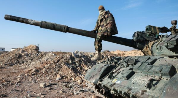 A militant poses for a picture after anti-government fighters seized Syrian army military equipment and vehicles that were abandoned on the highway to Damascus, as they reach the town of Suran north of Syria's Hama city on December 3, 2024. Islamist-led rebels advanced on Syria's fourth-largest city Hama on December 3, buoyed by their lightning capture of swathes of the north in an offensive that ended four years of relative calm.,Image: 942422650, License: Rights-managed, Restrictions: , Model Release: no, Credit line: Omar HAJ KADOUR / AFP / Profimedia