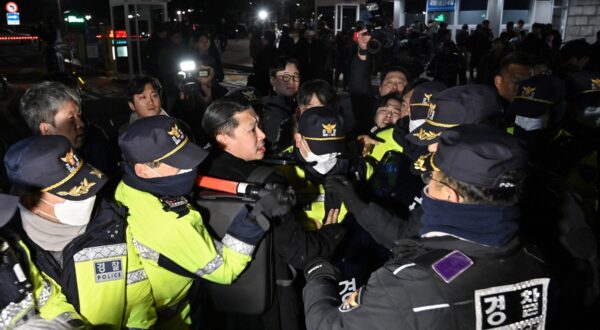 Police attempt to hold back people trying to enter the National Assembly in front of the main gate of the National Assembly in Seoul, South Korea on December 3, 2024, after President Yoon Suk Yeol declared emergency martial law.  South Korea's President Yoon Suk Yeol on December 3 declared emergency martial law, saying the step was necessary to protect the country from 