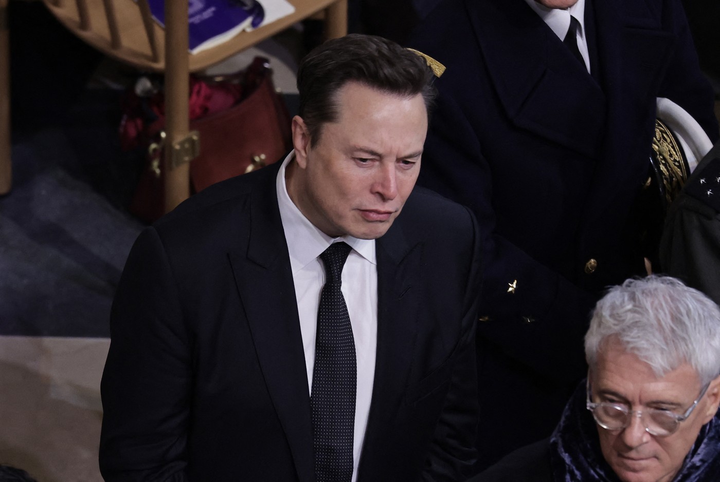 Tesla and SpaceX CEO Elon Musk (C) looks on inside Notre-Dame Cathedral during a ceremony to mark the re-opening of the landmark cathedral, in central, Paris on December 7, 2024. Around 50 heads of state and government are expected in the French capital to attend the ceremony marking the rebuilding of the Gothic masterpiece five years after the 2019 fire which ravaged the world heritage landmark and toppled its spire. Some 250 companies and hundreds of experts were part of the five-year restoration project at a cost of hundreds of millions of euros.,Image: 944115887, License: Rights-managed, Restrictions: , Model Release: no, Credit line: Christophe PETIT TESSON / AFP / Profimedia