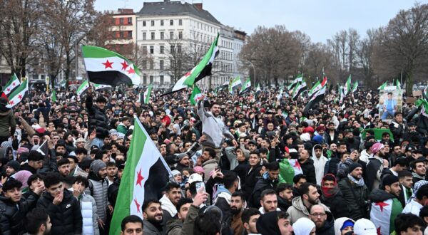 Members of the Syrian community wave Syrian flags as they attend a rally on December 8, 2024 in Berlin, Germany, to celebrate the end of Syrian dictator Bashar al-Assad's rule after rebel fighters took control of the Syrian capital Damascus overnight. Islamist-led rebels toppled Syria's longtime ruler Bashar al-Assad in a lightning offensive that a UN envoy called "a watershed moment" for the nation marred by civil war.,Image: 944384267, License: Rights-managed, Restrictions: , Model Release: no, Credit line: RALF HIRSCHBERGER / AFP / Profimedia