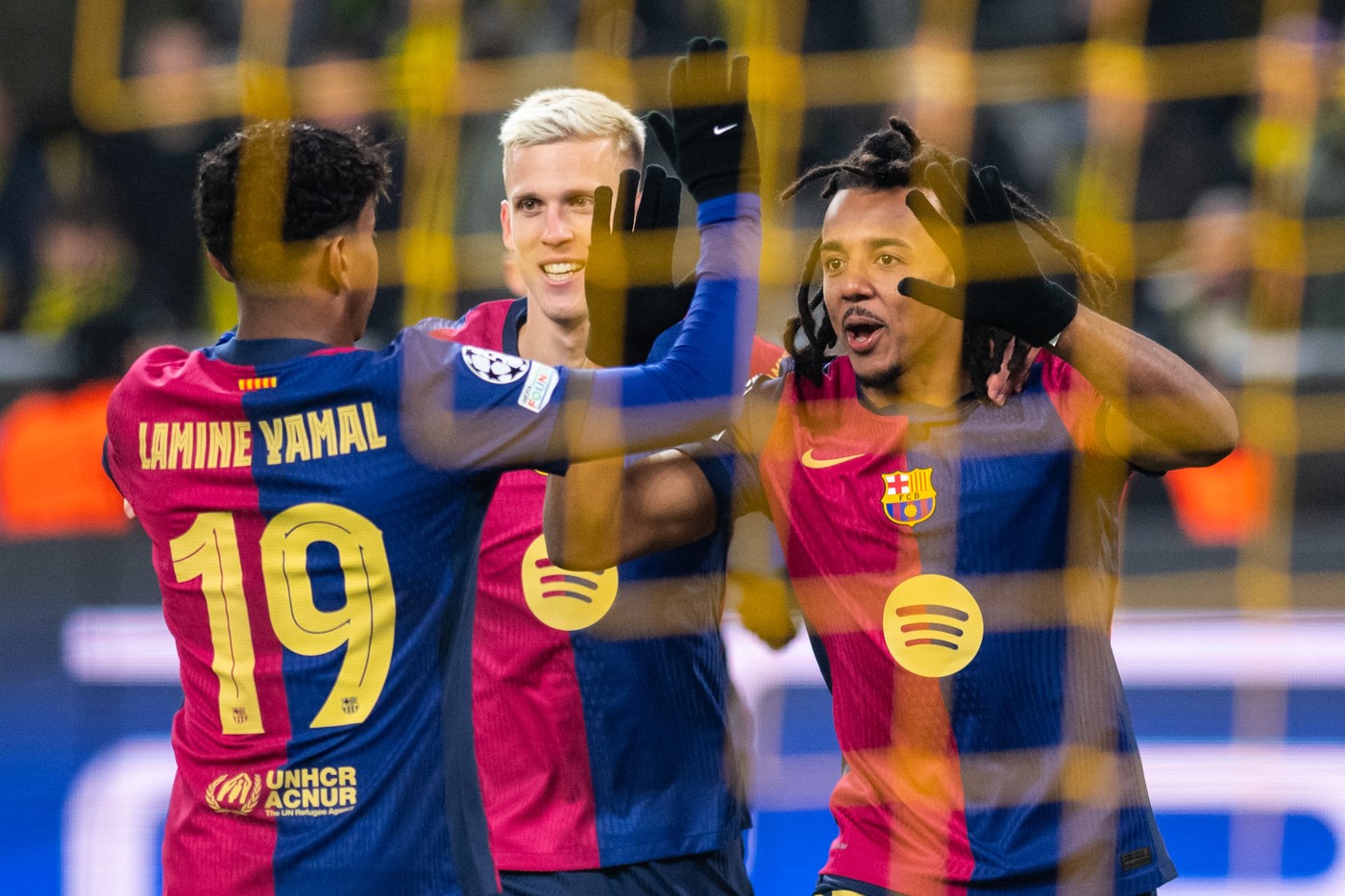 DORTMUND, GERMANY - DECEMBER 11: Lamine Yamal, Dani Olmo and Jules Kounde (L-R) of Barcelona celebrate after their team's first goal during the UEFA Champions League 2024/25 League Phase MD6 match between Borussia Dortmund and FC Barcelona at BVB Stadion Dortmund in Dortmund, Germany on December 11, 2024. Hesham Elsherif / Anadolu,Image: 945692294, License: Rights-managed, Restrictions: , Model Release: no, Credit line: Hesham Elsherif / AFP / Profimedia