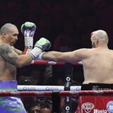 RIYADH, SAUDI ARABIA - DECEMBER 22: Oleksandr Usyk of Ukraine in action against Tyson Fury of United Kingdom during â€œRiyadh Seasonâ€ boxing match event at the Kingdom Arena in Riyadh, Saudi Arabia on December 22, 2024. Mohammed Saad / Anadolu,Image: 949217587, License: Rights-managed, Restrictions: , Model Release: no, Credit line: Mohammed Saad / AFP / Profimedia