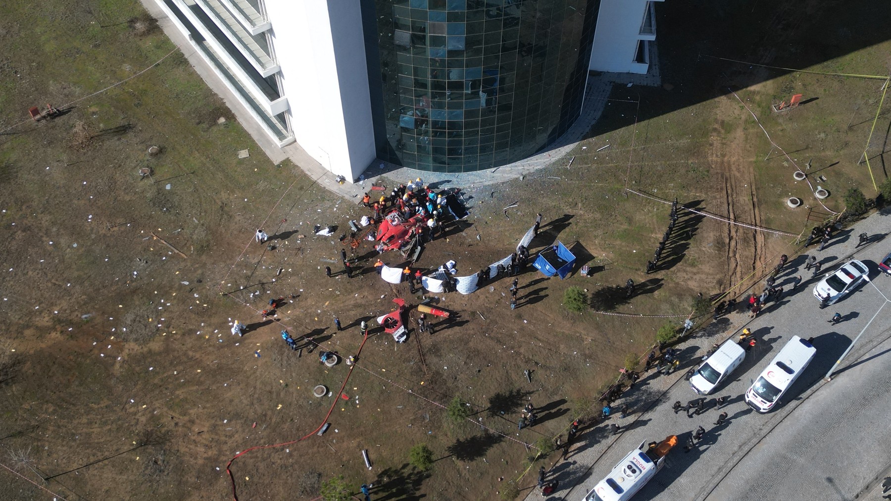 MUGLA, TURKIYE - DECEMBER 22: An aerial view of the scene and the hospital building after a helicopter crashed into Mugla Training and Research Hospital on December 22, 2024 in Mugla, Turkiye. Two pilots, one doctor, and one health care worker lost their lives as the helicopter crashed into the Training and Research Hospital building in Mugla's Mentese district. Fire, health and police teams as well as personnel from Turkiye's Disaster and Emergency Management Authority (AFAD) were dispatched to the scene. Ali Balli / Anadolu/ABACAPRESS.COM,Image: 949238333, License: Rights-managed, Restrictions: , Model Release: no, Credit line: AA/ABACA / Abaca Press / Profimedia