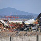 SEOUL, Dec. 29, 2024  -- This photo shows the site of an airplane crash at the Muan International Airport, some 290 km southwest of Seoul, South Korea, Dec. 29, 2024.
  Most of the people aboard a South Korean airplane that crashed at an airport in southwest South Korea on Sunday morning were believed to have been killed except two rescued, local fire authorities said.
  The passenger plane with 175 passengers, including 173 South Koreans and two Thais, as well as six flight attendants on board, crashed while attempting to land at the Muan International Airport, some 290 km southwest of the capital Seoul, at about 9:07 a.m. local time (0007 GMT).,Image: 950672894, License: Rights-managed, Restrictions: , Model Release: no, Credit line: NEWSIS / Xinhua News / Profimedia