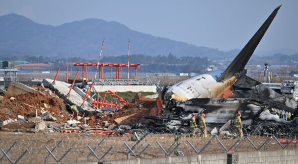 SEOUL, Dec. 29, 2024  -- This photo shows the site of an airplane crash at the Muan International Airport, some 290 km southwest of Seoul, South Korea, Dec. 29, 2024.
  Most of the people aboard a South Korean airplane that crashed at an airport in southwest South Korea on Sunday morning were believed to have been killed except two rescued, local fire authorities said.
  The passenger plane with 175 passengers, including 173 South Koreans and two Thais, as well as six flight attendants on board, crashed while attempting to land at the Muan International Airport, some 290 km southwest of the capital Seoul, at about 9:07 a.m. local time (0007 GMT).,Image: 950672894, License: Rights-managed, Restrictions: , Model Release: no, Credit line: NEWSIS / Xinhua News / Profimedia