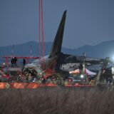 Firefighters and rescue personnel work near the scene where a Jeju Air Boeing 737-800 series aircraft crashed and burst into flames at Muan International Airport in South Jeolla Province, some 288 kilometres southwest of Seoul on December 29, 2024.  A Jeju Air plane carrying 181 people from Thailand to South Korea crashed on arrival, smashing into a barrier and bursting into flames, leaving all but two feared dead.,Image: 950680352, License: Rights-managed, Restrictions: , Model Release: no, Credit line: JUNG YEON-JE / AFP / Profimedia