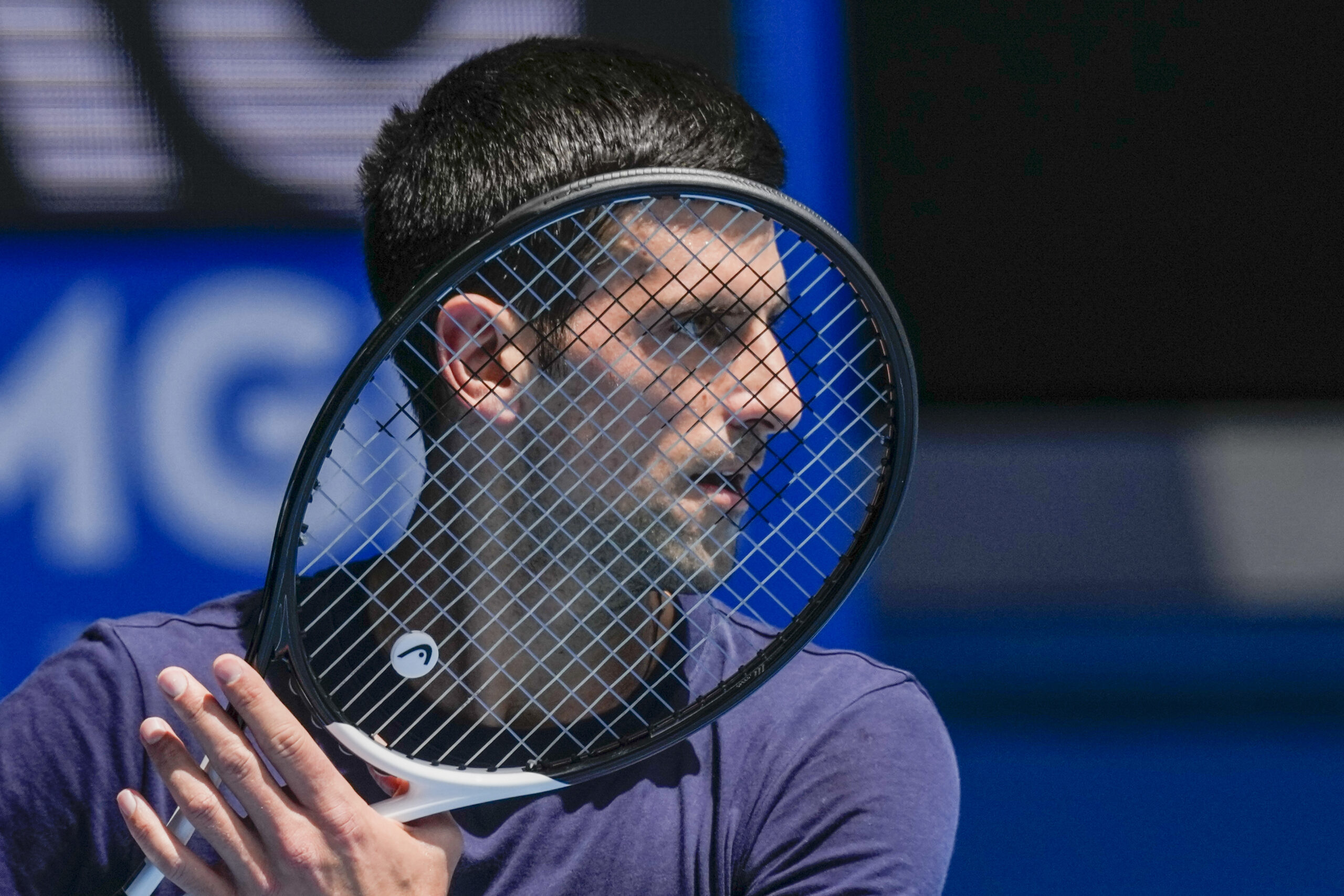 Defending men's champion Serbia's Novak Djokovic practices on Rod Laver Arena ahead of the Australian Open tennis championship in Melbourne, Australia, Wednesday, Jan. 12, 2022. AP Photo/Mark Baker)