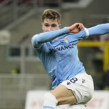 Lazio's Toma Basic controls the ball during an Italian Cup soccer match between AC Milan and Lazio at the San Siro stadium, in Milan, Italy, Wednesday, Feb. 9, 2022. (AP Photo/Antonio Calanni)