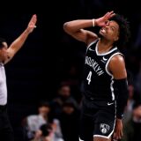 Brooklyn Nets guard Dennis Smith Jr. (4) reacts after making a 3-point shot during the second half of an NBA basketball game against the San Antonio Spurs, Saturday, Feb. 10, 2024, in New York. (AP Photo/Noah K. Murray) Spurs Nets Basketball