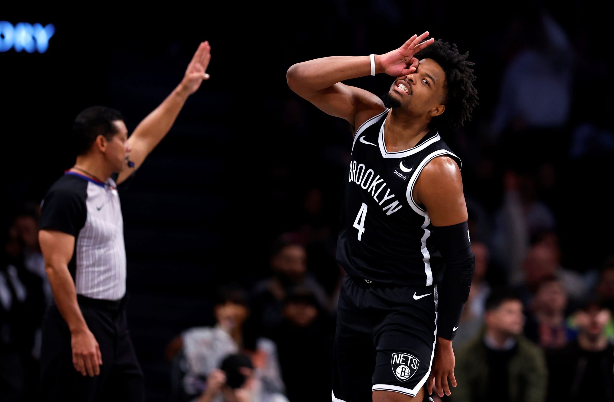 Brooklyn Nets guard Dennis Smith Jr. (4) reacts after making a 3-point shot during the second half of an NBA basketball game against the San Antonio Spurs, Saturday, Feb. 10, 2024, in New York. (AP Photo/Noah K. Murray) Spurs Nets Basketball