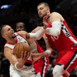 Portland Trail Blazers forward Toumani Camara, left, tries to get around Los Angeles Clippers center Ivica Zubac (40) as he goes to the basket during the first half of an NBA basketball game, Thursday, Jan. 16, 2025, in Portland, Ore. (AP Photo/Jenny Kane) Clippers Trail Blazers Basketball