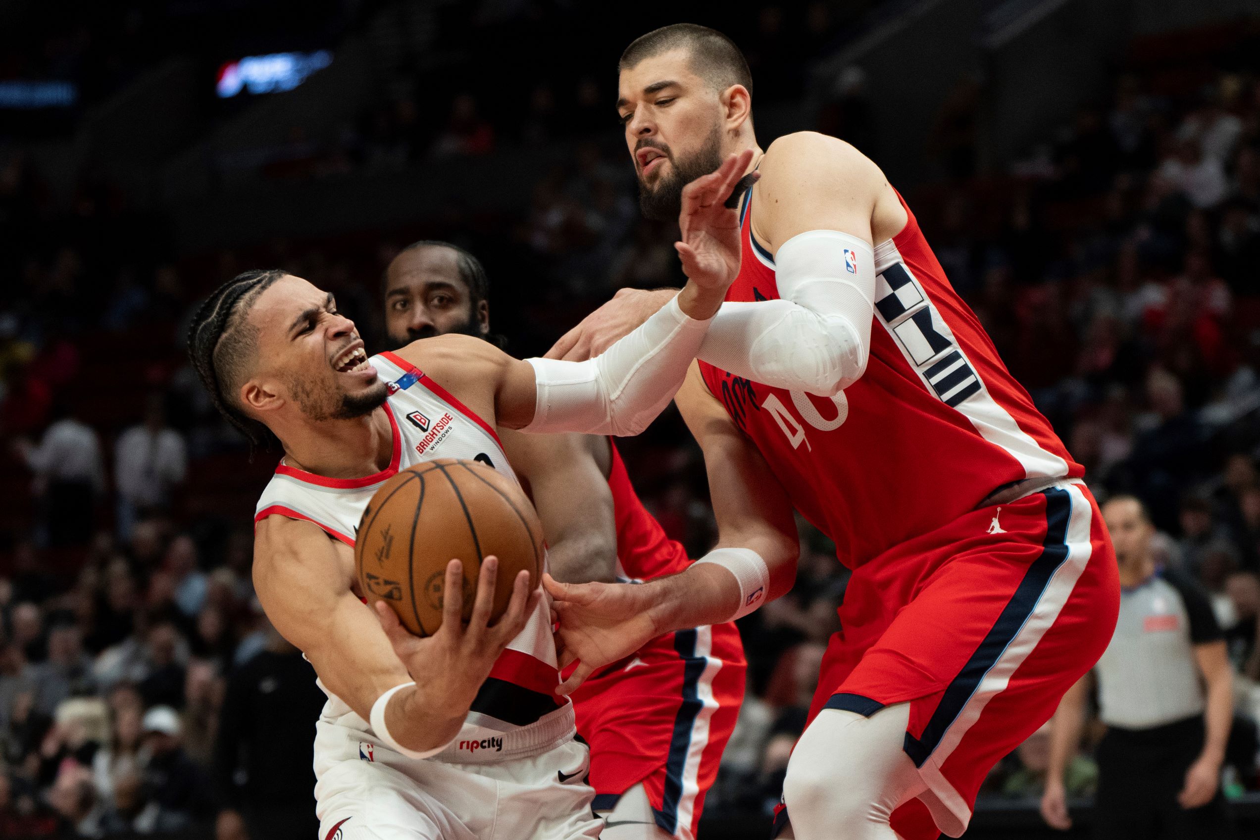 Portland Trail Blazers forward Toumani Camara, left, tries to get around Los Angeles Clippers center Ivica Zubac (40) as he goes to the basket during the first half of an NBA basketball game, Thursday, Jan. 16, 2025, in Portland, Ore. (AP Photo/Jenny Kane) Clippers Trail Blazers Basketball