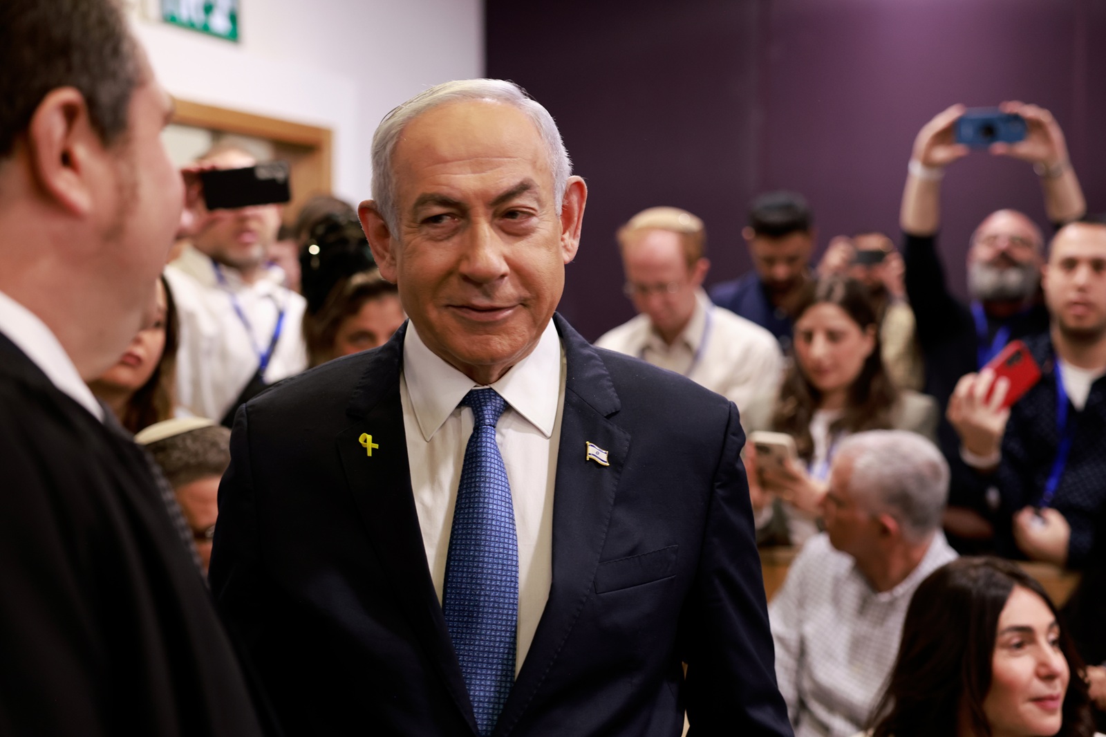 epa11767623 Israeli Prime Minister Benjamin Netanyahu arrives at the district court for his hearing on corruption charges, Tel Aviv, Israel, 10 December 2024. Benjamin Netanyahu is expected to testify for the first time when his corruption case resumes on 10 December on charges of bribery, fraud and breach of public trust in three separate cases.  EPA/MENAHEM KAHANA / POOL