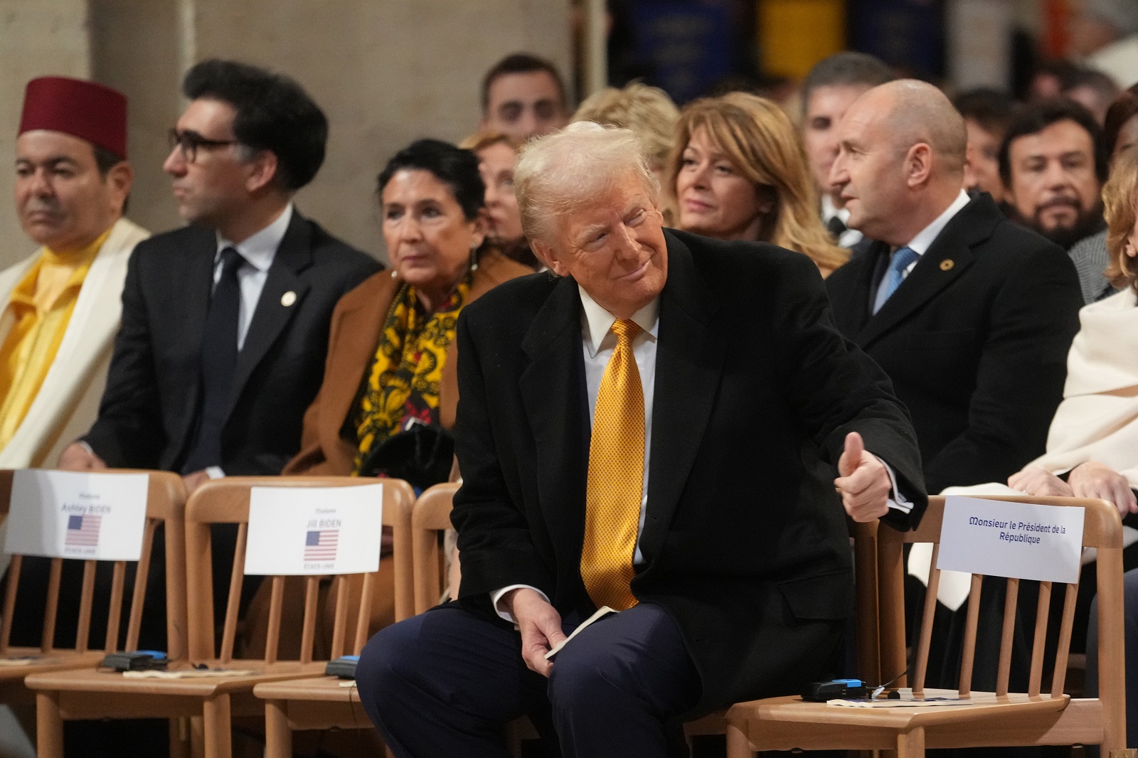 epa11763097 US President-elect Donald Trump (C) gestures as he sits inside the Notre Dame de Paris cathedral during its official reopening ceremony, in Paris, France, 07 December 2024. The Notre Dame de Paris Cathedral reopens on 07 December after nearly six years of renovation work following its destruction by a fire on 15 April 2019.  EPA/THIBAULT CAMUS / POOL  MAXPPP OUT