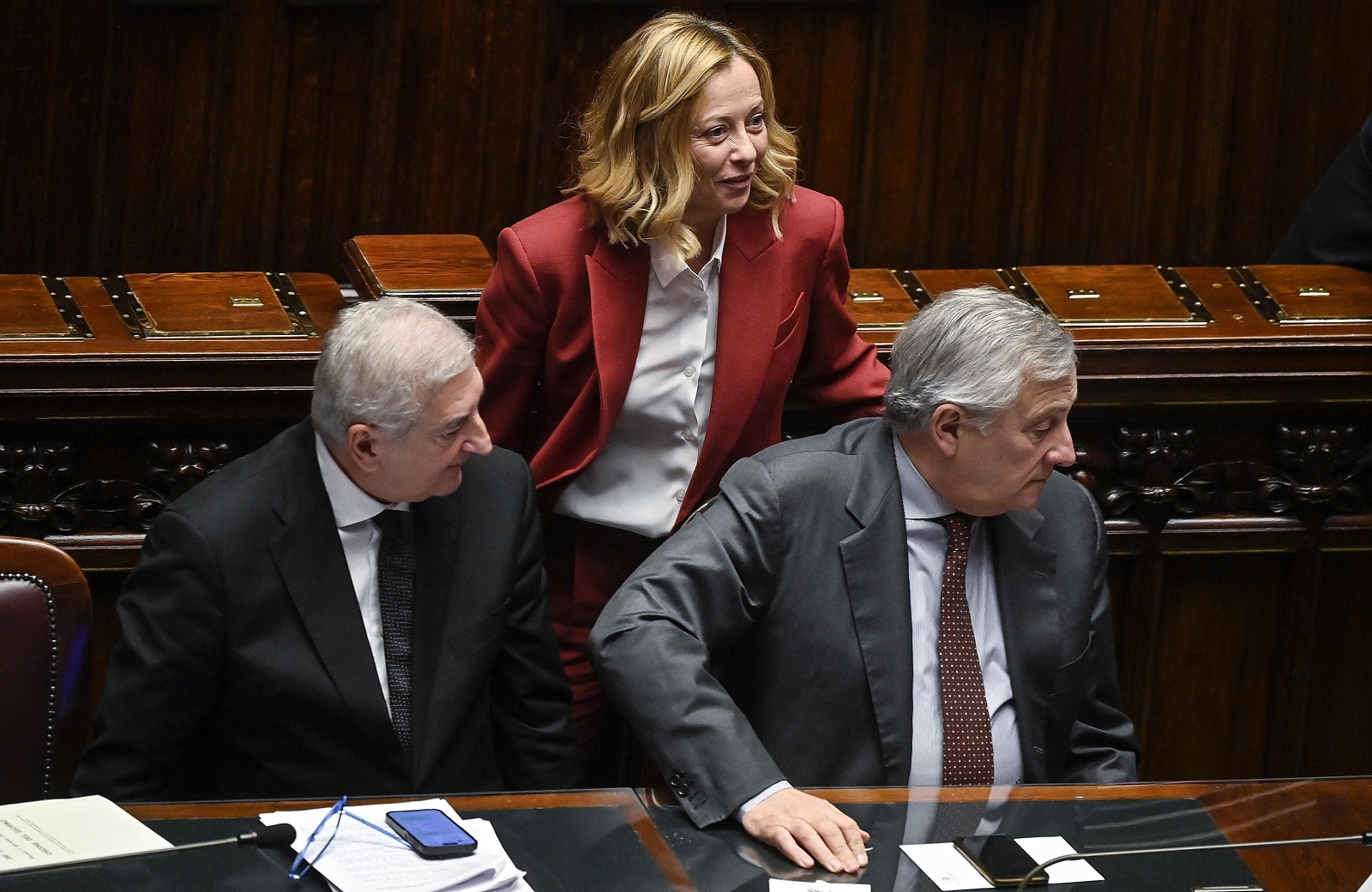 epa11782492 Italian Prime Minister Giorgia Meloni (C), with Italian Minister of European Affairs, Tommaso Foti (L), and Italian Minister of Foreign Affairs, Antonio Tajani (R), as she reports at the Chamber of Deputies on the upcoming European Council, in Rome, Italy, 17 December 2024. EU leaders will attend a European Council meeting in Brussels on 19 December.  EPA/RICCARDO ANTIMIANI