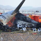 epa11799471 A police forensic team conducts an on-site investigation at the scene of the 29 December Jeju Air passenger plane crash at Muan International Airport in Muan, South Korea, 31 December 2024.  EPA/YONHAP SOUTH KOREA OUT