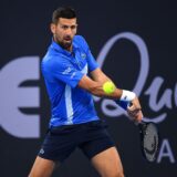 epa11799684 Novak Djokovic of Serbia in action against Rinky Hijikata of Australia during their Brisbane International tennis tournament match at Queensland Tennis Centre in Brisbane, Australia, 31 December 2024.  EPA/JONO SEARLE  AUSTRALIA AND NEW ZEALAND OUT