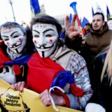 epa11820607 Romanians hold banner reading 'Justice For Romania!' during a protest against the cancellation of the first round of presidential elections in downtown Bucharest, Romania, 12 January 2025. The ultra-nationalist party Alliance for the Union of Romanians (AUR) organized the protest in response to the Romanian Constitutional Court's (CCR) decision to annul the presidential elections held in December 2024, demanding the reversal of the CCR's ruling and the continuation of the second round of the presidential elections.  EPA/ROBERT GHEMENT