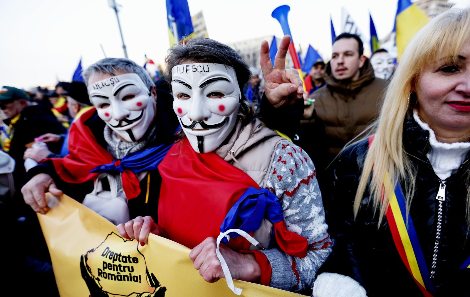 epa11820607 Romanians hold banner reading 'Justice For Romania!' during a protest against the cancellation of the first round of presidential elections in downtown Bucharest, Romania, 12 January 2025. The ultra-nationalist party Alliance for the Union of Romanians (AUR) organized the protest in response to the Romanian Constitutional Court's (CCR) decision to annul the presidential elections held in December 2024, demanding the reversal of the CCR's ruling and the continuation of the second round of the presidential elections.  EPA/ROBERT GHEMENT