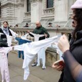 epa11833869 Pro-Palestinian activists holding children's clothes representing children killed in the war in Gaza while demonstrating on Whitehall in London, Britain, 18 January 2025. Protesters demand the end of Israeli operations in the Gaza Strip and for the British government to end to all arms trade with Israel. A plan for a protest march was changed by the Metropolitan Police through their powers under the Public Order Act as it was due to pass a synagogue in central London.  EPA/DAVID CLIFF