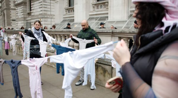 epa11833869 Pro-Palestinian activists holding children's clothes representing children killed in the war in Gaza while demonstrating on Whitehall in London, Britain, 18 January 2025. Protesters demand the end of Israeli operations in the Gaza Strip and for the British government to end to all arms trade with Israel. A plan for a protest march was changed by the Metropolitan Police through their powers under the Public Order Act as it was due to pass a synagogue in central London.  EPA/DAVID CLIFF