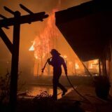 January 8, 2025, Altadena, California, USA: A Firefighter works to save a home during the Eaton fire outside of Los Angeles. Evacuation orders are in place after a fast moving brush fire broke out Tuesday night. Four fires are currently burning, Palisades, Eaton, Hurst and Woodley, all are 0% contained with two people killed and more than 1,000 structures burnt. Palisades has now become the most destructive in LA's history. Tens of thousands of people have been forced to evacuate their homes.,Image: 952438193, License: Rights-managed, Restrictions: , Model Release: no, Credit line: Andrew Silk / Zuma Press / Profimedia