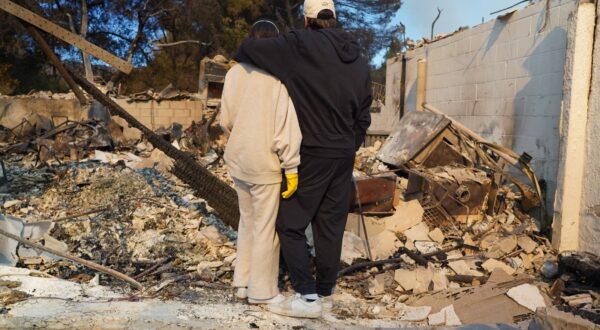 Kyle Kucharski hugs his partner Nicole Perri as they stand on the ruins of their house destroyed by the Palisades Fire in the Pacific Palisades neighborhood of Los Angeles, California on January 10, 2025.  When Kyle Kucharski and Nicole Perri moved into their dream home in the Pacific Palisades area of Los Angeles, they bought a crate of wine to mark the realization of a dream, and put it aside for a special day.
That day never came. 
Now after a raging fire destroyed almost the entire neighborhood, all they have left is the empty box with the brand name written across it: Purgatory.,Image: 952856518, License: Rights-managed, Restrictions: To go with AFP story by Paula RAMON: "'Purgatory: Los Angeles fire leaves nothing but a tiny memento", Model Release: no, Credit line: Cecilia SANCHEZ / AFP / Profimedia