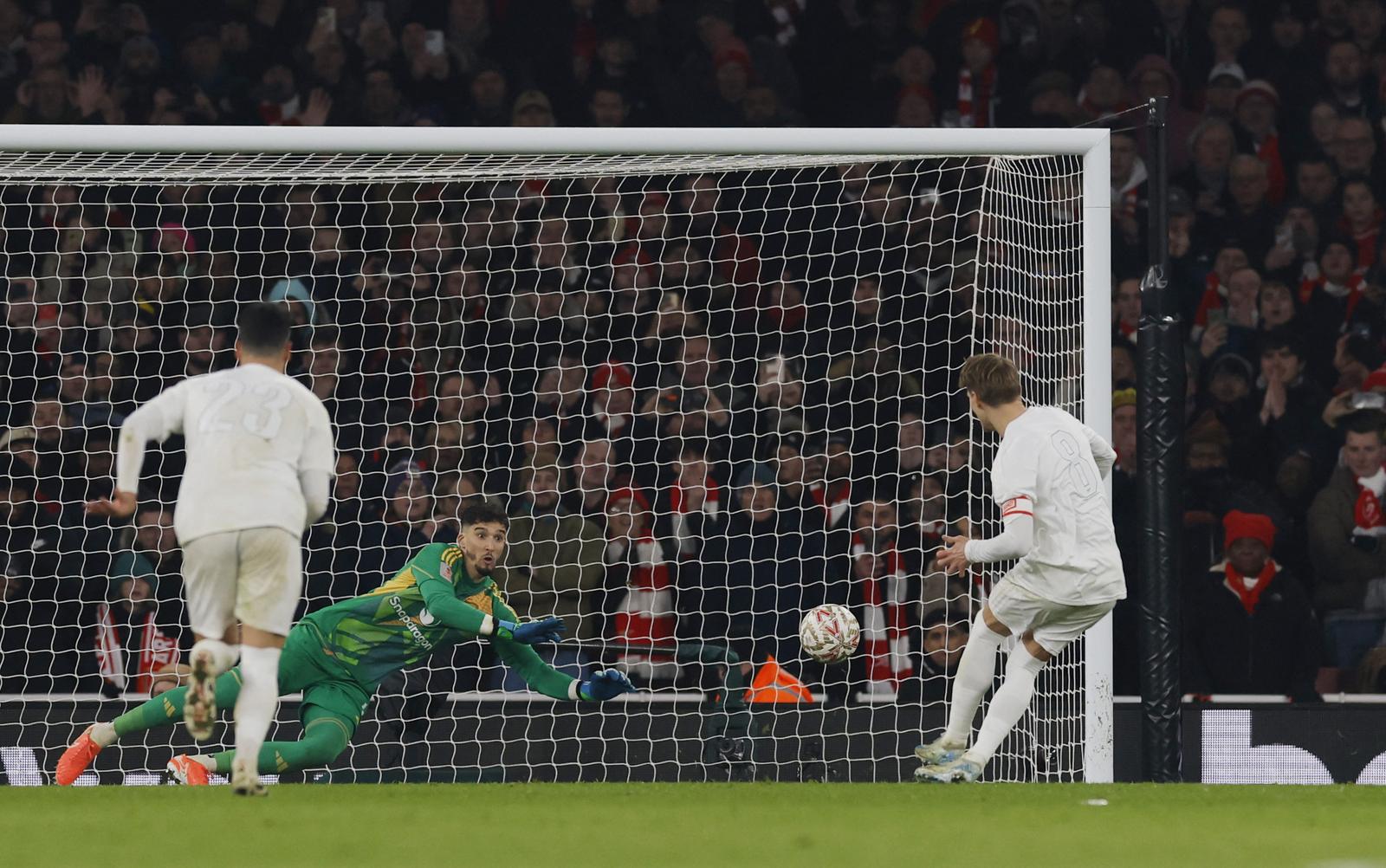 Soccer Football - FA Cup - Third Round - Arsenal v Manchester United - Emirates Stadium, London, Britain - January 12, 2025 Arsenal's Martin Odegaard has his shot saved by Manchester United's Altay Bayindir from the penalty spot Action Images via Reuters/Andrew Couldridge Photo: Andrew Couldridge/REUTERS