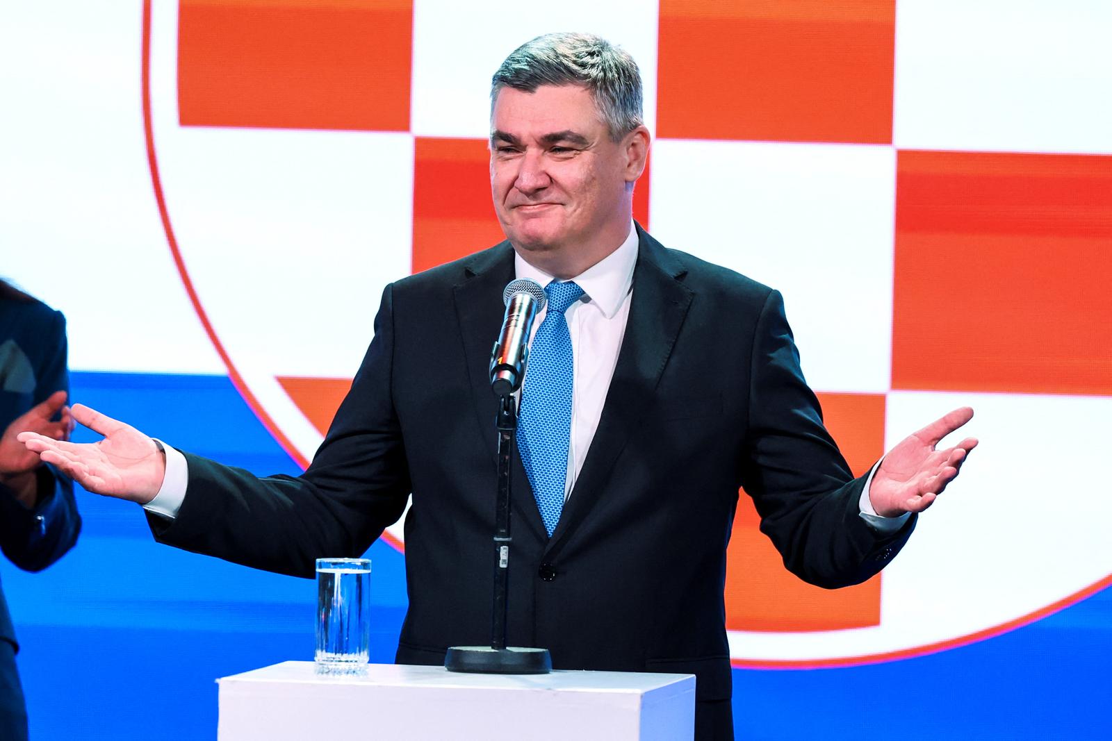 Croatian President and presidential candidate Zoran Milanovic gestures on stage after the first unofficial results of the second round of the presidential election, at Zoran Milanovic's headquarters in Zagreb, Croatia, January 12, 2025. REUTERS/Antonio Bronic Photo: Antonio Bronic/REUTERS