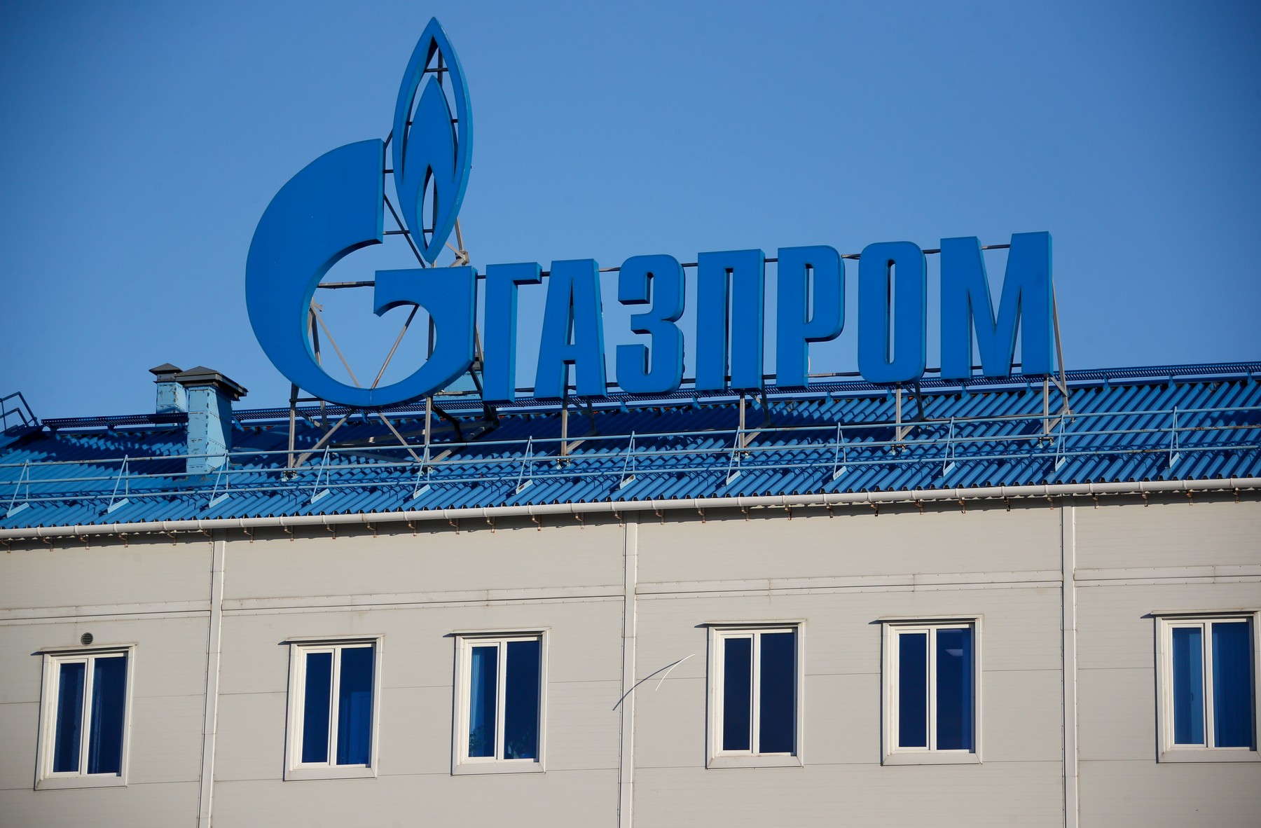 KRASNODAR TERRITORY, RUSSIA - OCTOBER 22, 2021: A Gazprom logo on a building of the Russkaya Compressor Station of the TurkStream gas pipeline in Anapa District of Krasnodar Territory in southern Russia. The initial point of gas shipment through the TurkStream, the Russkaya Compressor Station is one of the most powerful in the world. The station’s power capacity allows to create enough gas pressure to transport gas for over 900 km without any additional technical facilities. The station is equipped with seven 32-MWatt gas pumping units; the projected power capacity of 244 MWatt allows to create the output gas pressure of 28.45 MPa. Dmitry Feoktistov/TASS,Image: 639927870, License: Rights-managed, Restrictions: , Model Release: no, Credit line: Dmitry Feoktistov / TASS / Profimedia