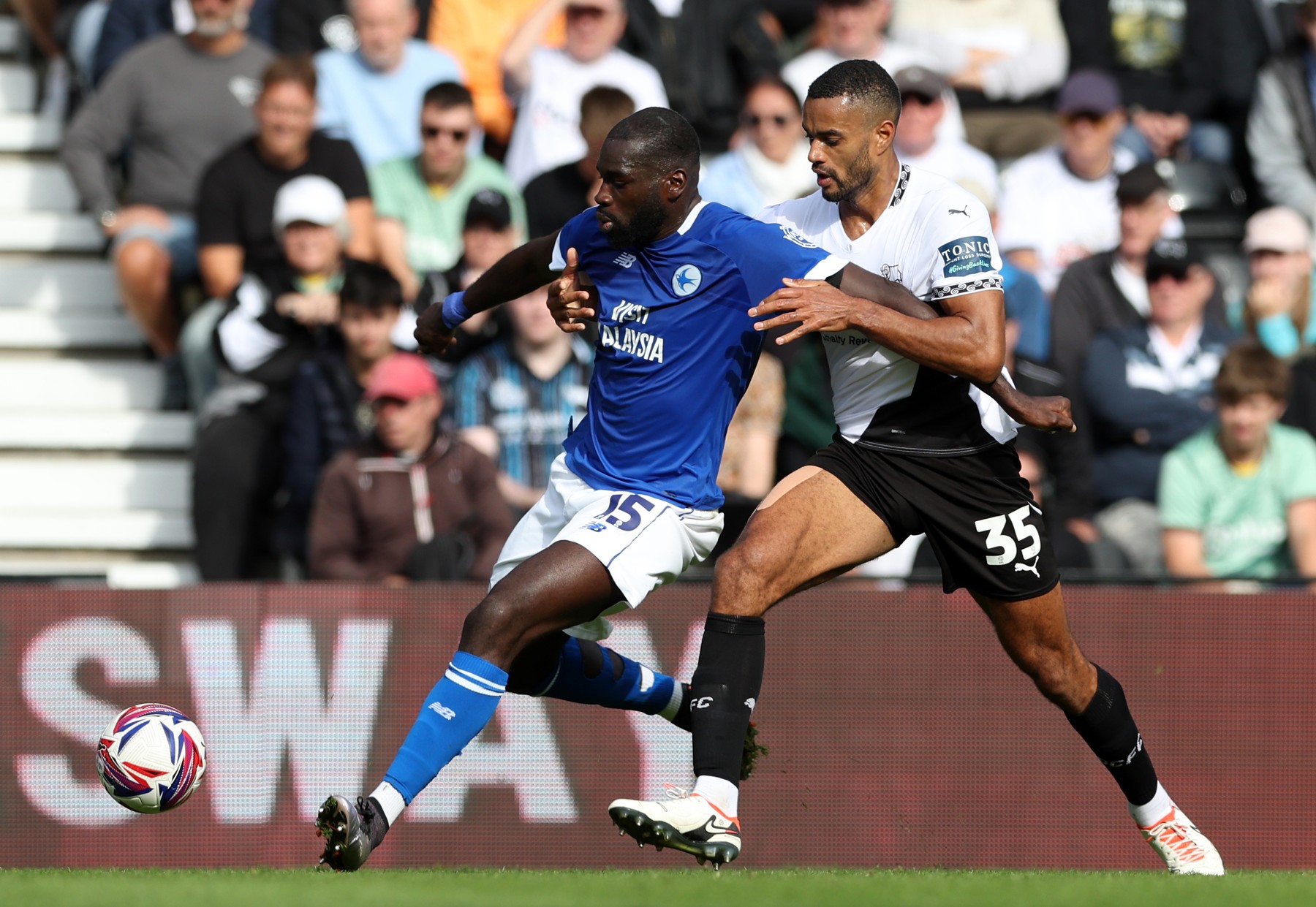 Cardiff City's Wilfried Kanga (left) and Derby County's Curtis Nelson battle for the ball during the Sky Bet Championship match at Pride Park, Derby. Picture date: Saturday September 14, 2024.,Image: 907636543, License: Rights-managed, Restrictions: RESTRICTIONS: EDITORIAL USE ONLY No use with unauthorised audio, video, data, fixture lists, club/league logos or "live" services. Online in-match use limited to 120 images, no video emulation. No use in betting, games or single club/league/player publ..., Model Release: no, Credit line: Barry Coombs / PA Images / Profimedia