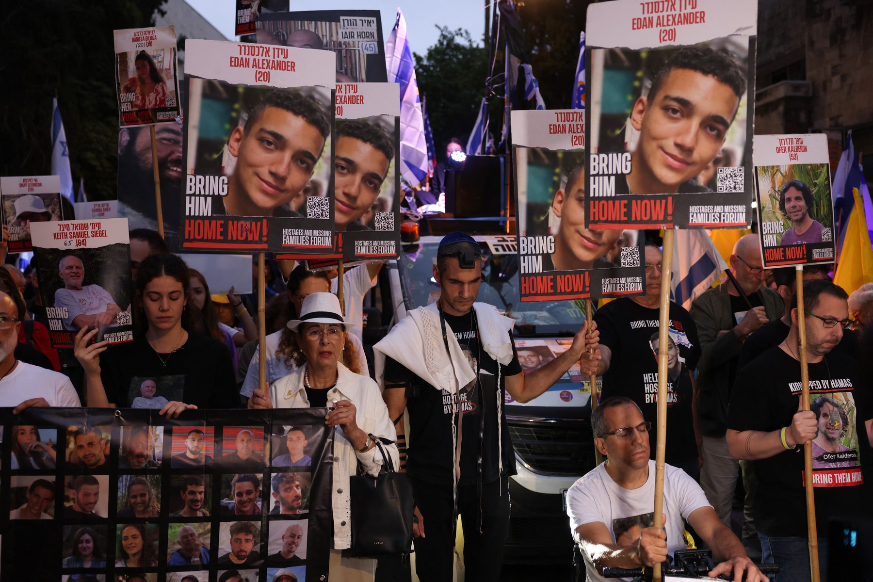 Relatives and supporters of Israeli hostages taken by Palestinian militants on the October 7 Hamas attack and held in Gaza, hold images of their loved ones during a protest calling for their release in front of Prime Minister Benjamin Netanyahu residency in Jerusalem on October 7, 2024.,Image: 917496529, License: Rights-managed, Restrictions: , Model Release: no, Credit line: Menahem KAHANA / AFP / Profimedia