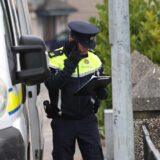 A Garda officer stands near a property on Beechwood Drive in Drogheda, where police are carrying out a forensic search in relation to the disappearance of Kyran Durnin, from Co Louth. A man is being detained on suspicion of the murder of the Irish schoolboy. Officers launched searches at two houses in Drogheda on Thursday with the aim of discovering any evidence which may reveal where Kyran is or what happened to him. Picture date: Thursday December 12, 2024.,Image: 945897953, License: Rights-managed, Restrictions: , Model Release: no, Credit line: Damien Eagers / PA Images / Profimedia