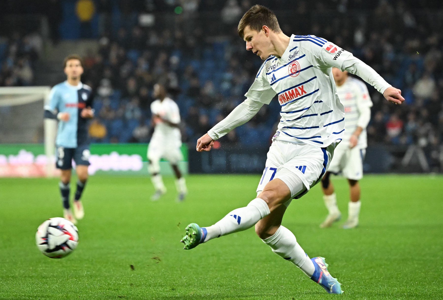 Strasbourg's Ukrainian defender #77 Eduard Sobol kicks the ball during the L1 French football match between Le Havre AC (HAC) and RC Strasbourg at the Oceane Stadium, in Le Havre, north-western France, on December 15, 2024.,Image: 947030062, License: Rights-managed, Restrictions: , Model Release: no, Credit line: Lou BENOIST / AFP / Profimedia