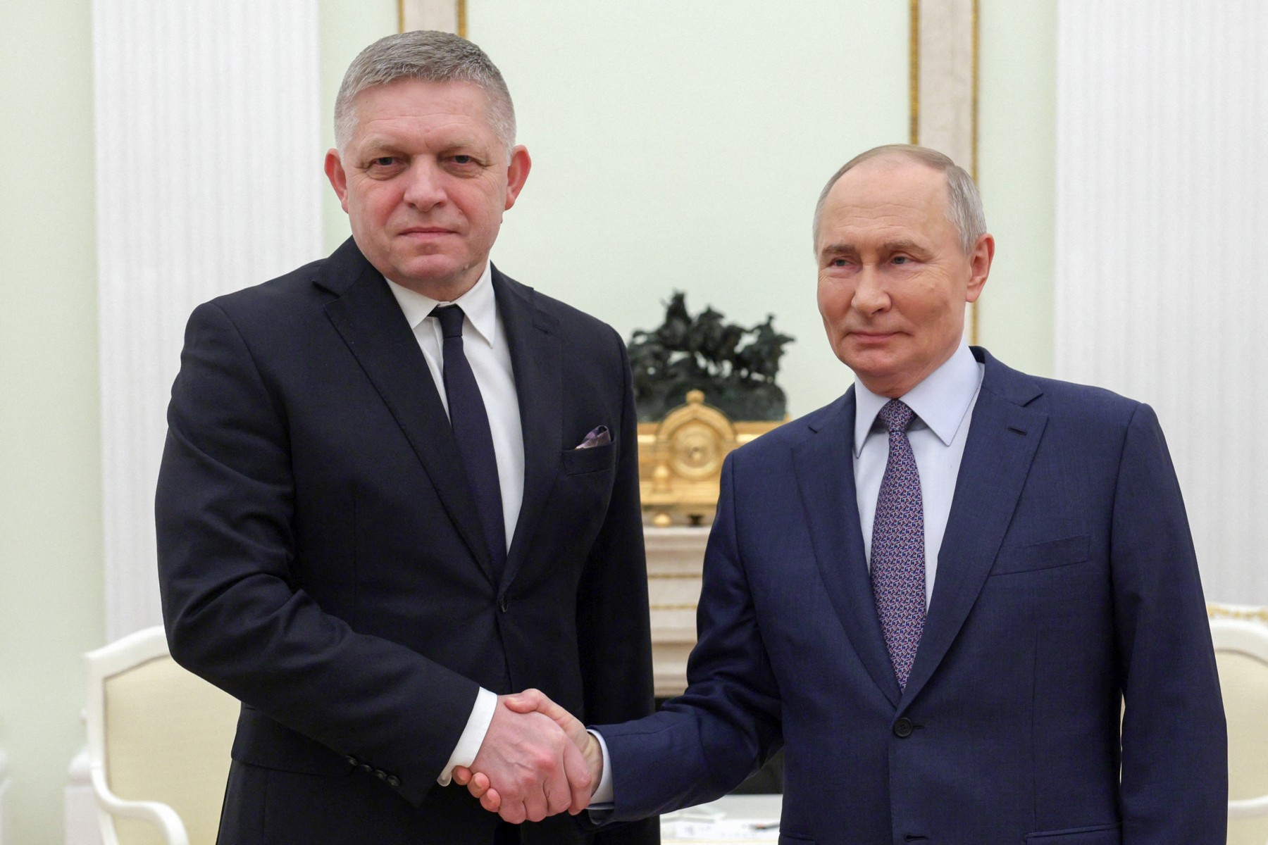 In this pool photograph distributed by Russian state agency Sputnik, Russia's President Vladimir Putin (R) shakes hands with Slovakia's Prime Minister Robert Fico (L) prior to their talks in Moscow on December 22, 2024.,Image: 949311759, License: Rights-managed, Restrictions: Editor's note : this image is distributed by Russian state owned agency Sputnik, Model Release: no, Credit line: Gavriil GRIGOROV / AFP / Profimedia