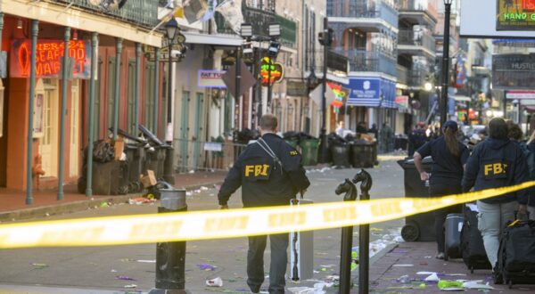 FBI investigators arrive at the scene where the white Ford F-150 pickup truck that crashed into a work lift after allegedly driving into a crowd of New Year's revelers in the French Quarter of New Orleans, Louisiana, on January 1, 2025. At least 10 people were killed and 30 injured Wednesday when a vehicle plowed overnight into a New year's crowd in the heart of the thriving New Orleans tourist district, authorities in the southern US city said.,Image: 951237976, License: Rights-managed, Restrictions: , Model Release: no, Credit line: Matthew HINTON / AFP / Profimedia